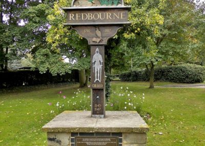 A town monument with Redbourne 1791-1917 and a knight, duck and possibly a pigeon on it